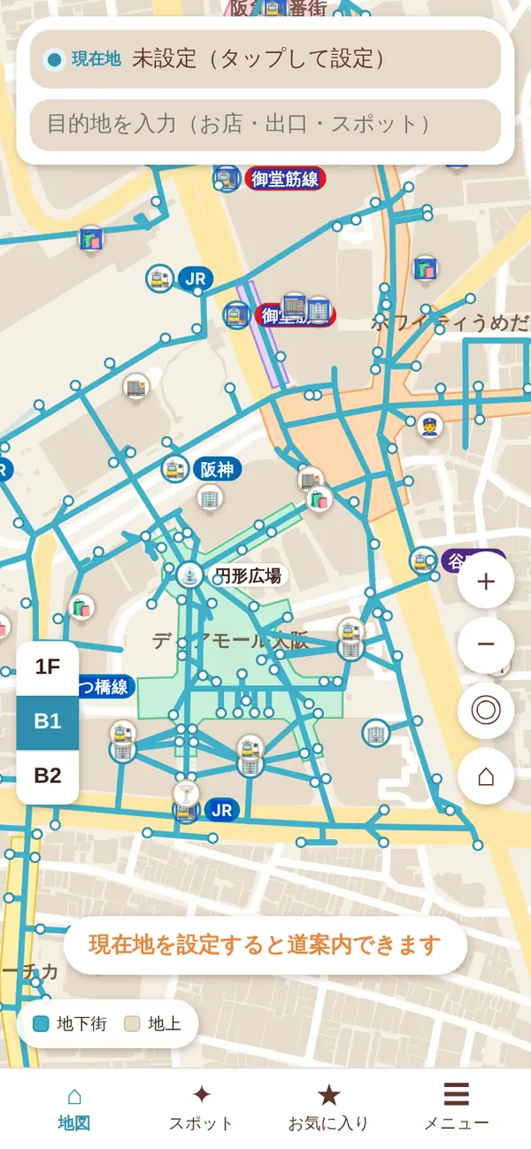 中くらいの拡大の地図。広場と地下街の名前、改札の路線名のバッジ、建物やお店のアイコンが出ていて、出口番号は点になっている